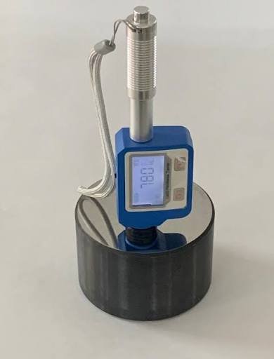 Portable hardness tester in use on a metal component